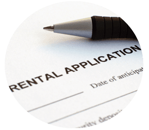 An image of rental appliacation form and a pen above the paper