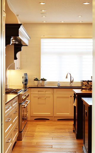 A well furnished kitchen with yellow walls