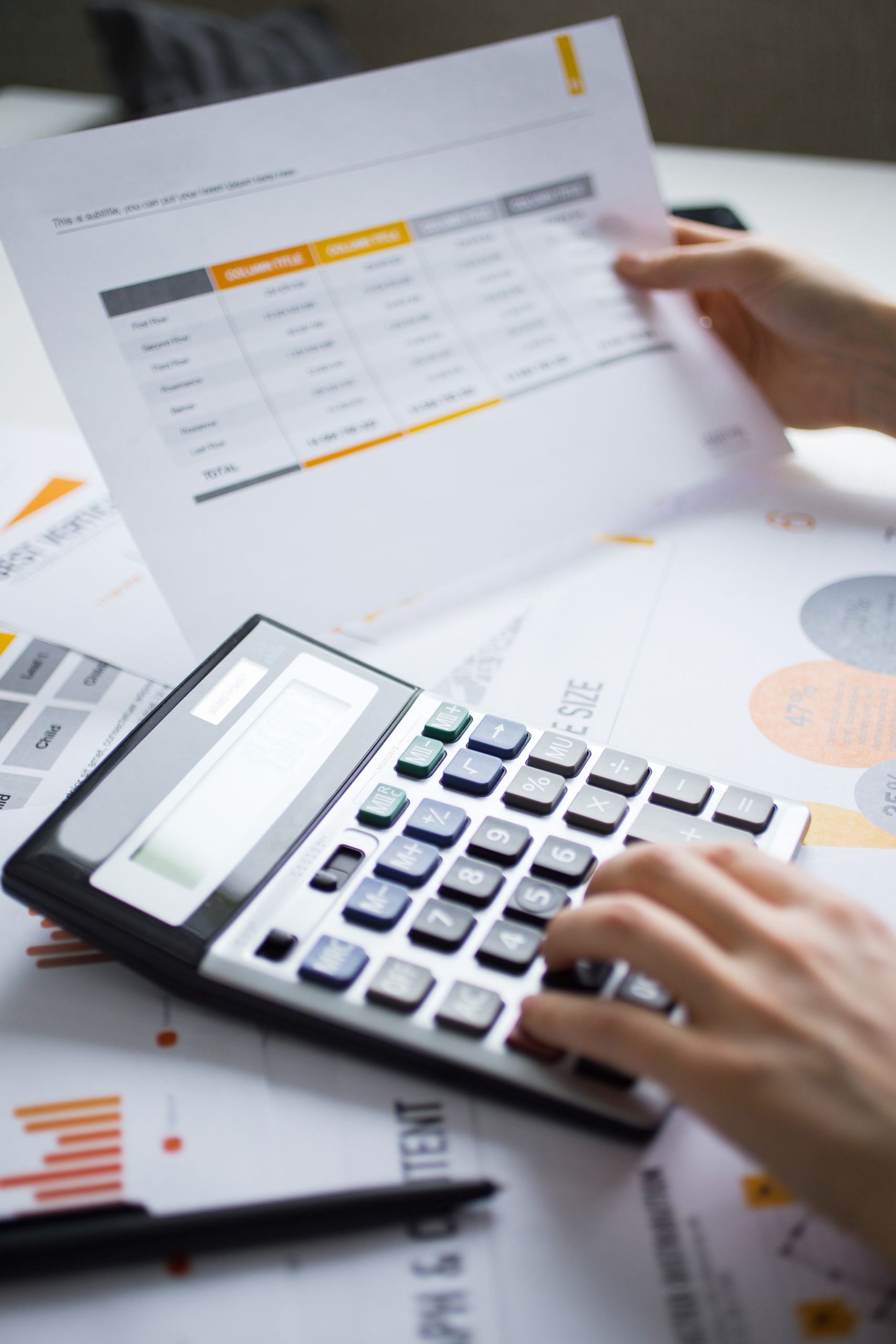 Cropped,View,Of,Accountant,Hands,Using,Calculator